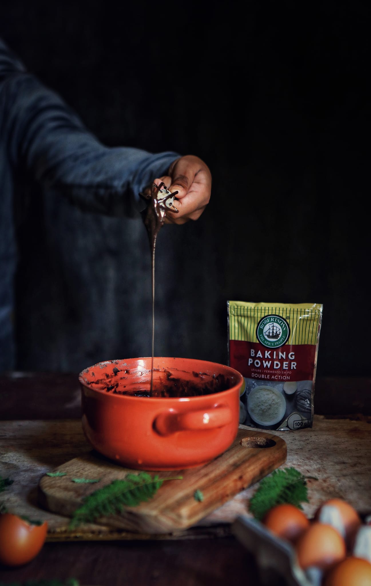 A person stirring a cocoa powder